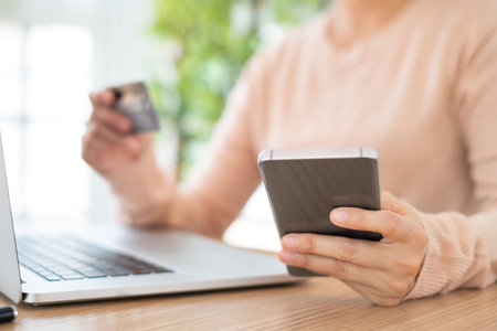 Mobile banking network. businesspeople using a mobile phone with credit cards online payment.