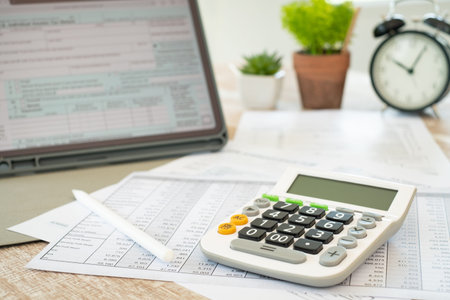 Tax concept, The calculator is placed on the tax accountant's desk.