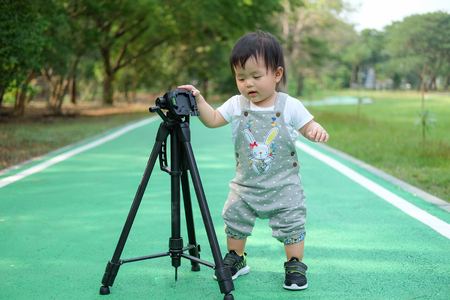 Cute Baby girl playing in the garden, close-up portrait, Portrait of a beautiful baby girlの写真素材