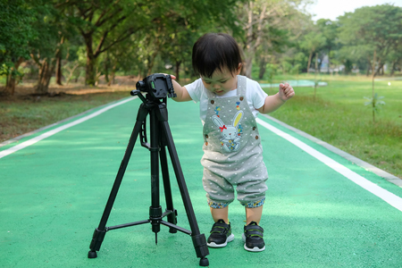Cute Baby girl playing in the garden, close-up portrait, Portrait of a beautiful baby girlの写真素材