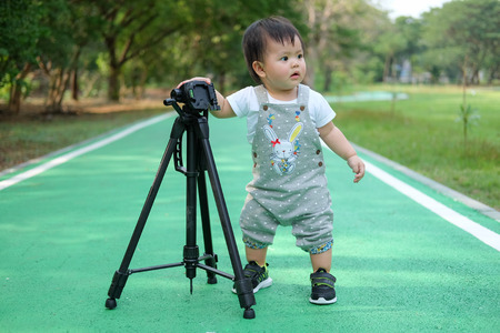 Cute Baby girl playing in the garden, close-up portrait, Portrait of a beautiful baby girlの写真素材