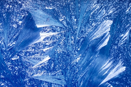 Abstract Winter background. Christmas abstract frostwork on a window glassの写真素材