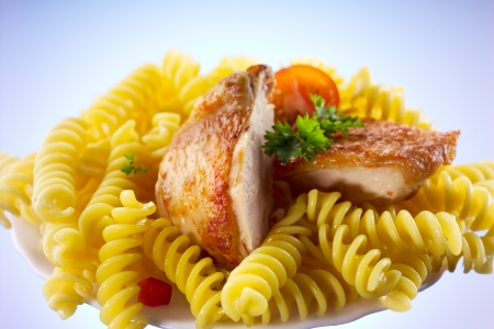 fusilli with chicken isolatedの写真素材