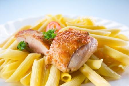 roasted chicken with pastaの写真素材