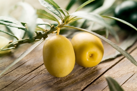 Green olives with leavesの写真素材