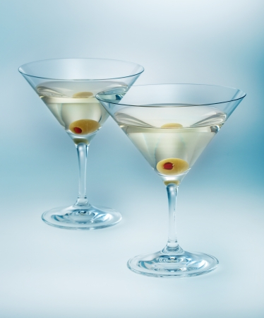 two glasses martini with olive  cocktail isolatedの写真素材
