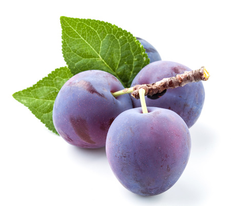Group of plums with leaf isolated on a white backgroundの写真素材