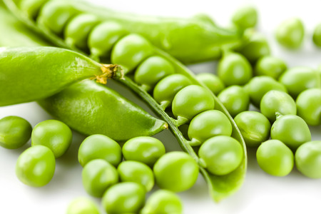 Pods of green peas on white backgroundの写真素材