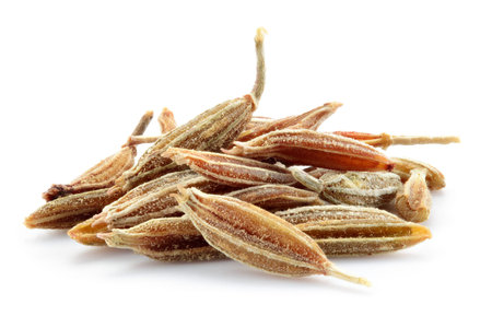 Cumin seeds macro. Caraway isolated on white background.