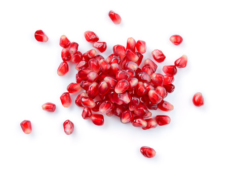 Pomegranate. Fresh raw seeds of pomegranate isolated on white background. Top view.の写真素材