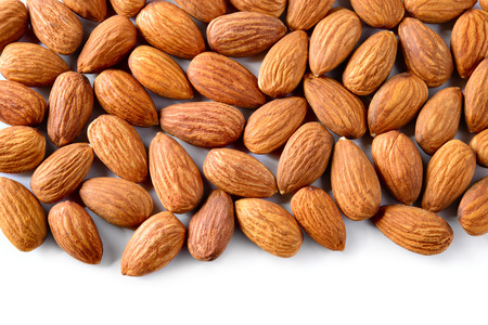 Almond isolated on white background. Macro. Almond background. Pile of almondsの写真素材