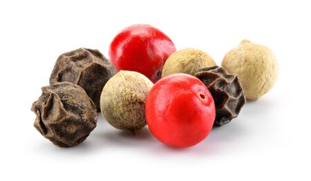 Mix of different peppers. Peppercorns isolated on white background. Macro. Full depth of field.の写真素材