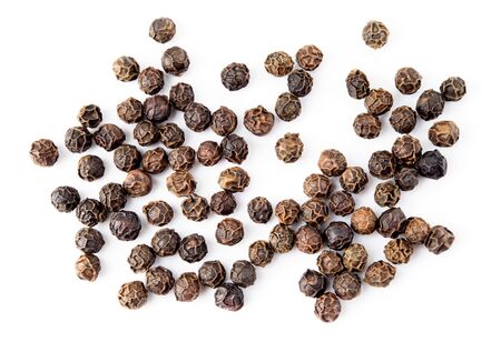 Black pepper. Peppercorns isolated on white. Macro. Top view.の写真素材