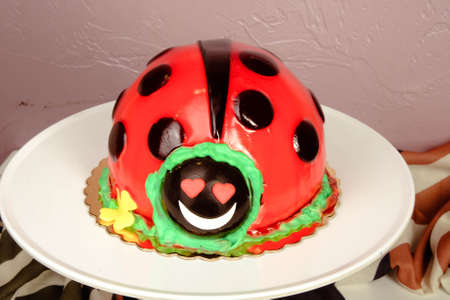 Board with delicious cake on tableの写真素材