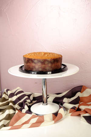 Board with delicious cake on tableの写真素材