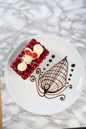 Board with delicious cake on table