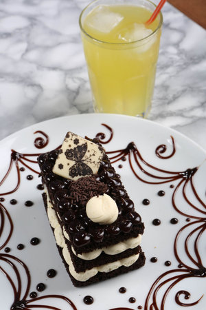 Board with delicious cake on table