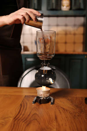 barista brewing coffee in the coffee roomの写真素材