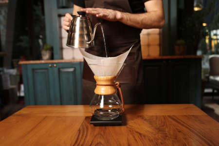 barista brewing coffee in the coffee roomの写真素材