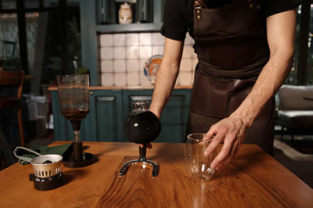 barista brewing coffee in the coffee roomの写真素材