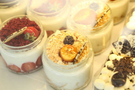 Board with delicious cake on tableの写真素材