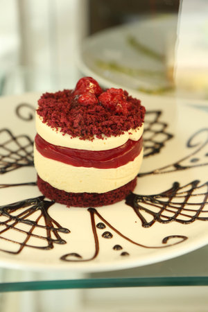 Board with delicious cake on table