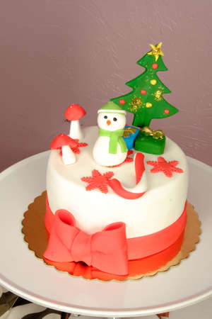 Board with delicious cake on tableの写真素材