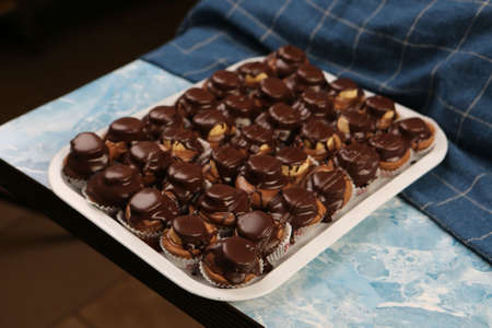 Board with delicious cake on tableの写真素材