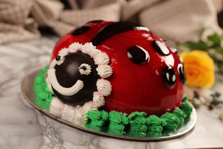 Board with delicious cake on tableの写真素材