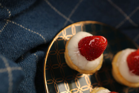 Board with delicious cake on tableの写真素材