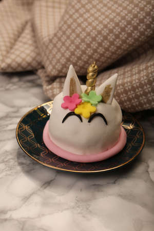 Board with delicious cake on tableの写真素材