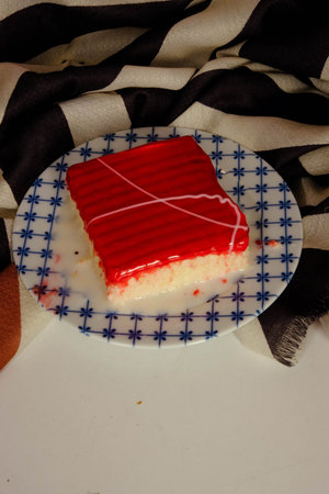 Board with delicious cake on table