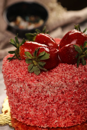 Board with delicious cake on table