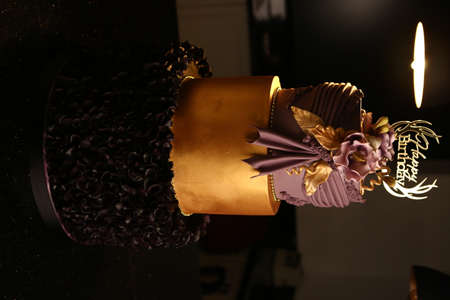 Board with delicious cake on tableの写真素材