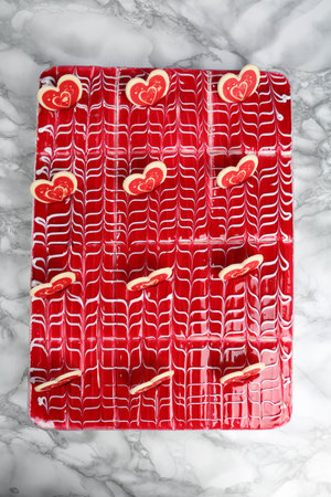 Board with delicious cake on table