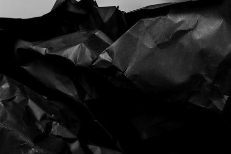 black creased crumpled paper background grunge texture backdrop