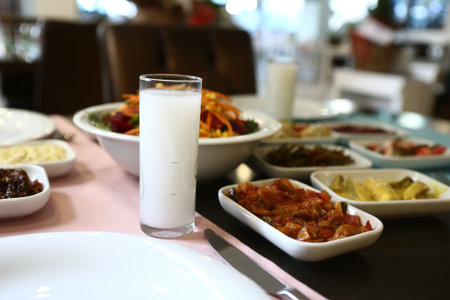 Turkish and Greek Traditional Dinning Table with Special Alcohol Drink Raki. Ouzo and Turkish Raki...