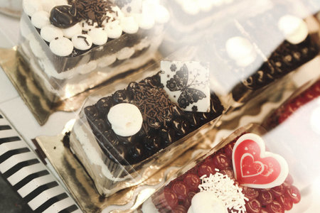 Board with delicious cake on tableの写真素材