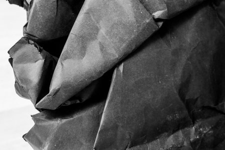 black creased crumpled paper background grunge texture backdrop