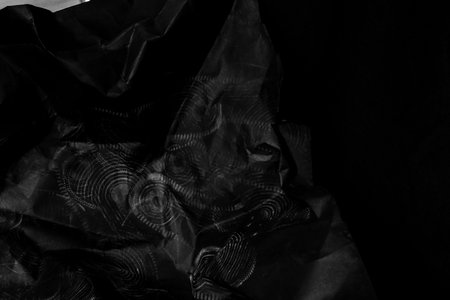 black creased crumpled paper background grunge texture backdrop