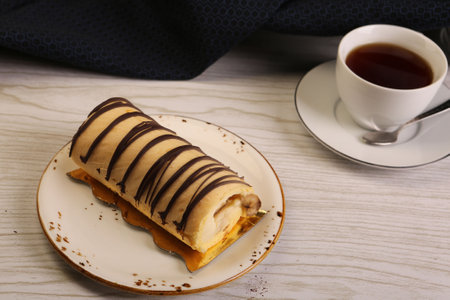 Board with delicious cake on tableの写真素材