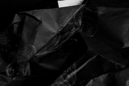 black creased crumpled paper background grunge texture backdrop