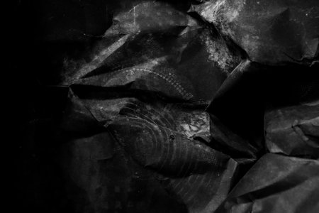 black creased crumpled paper background grunge texture backdrop