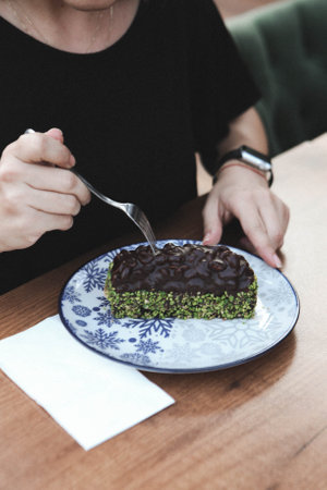 Board with delicious cake on tableの写真素材