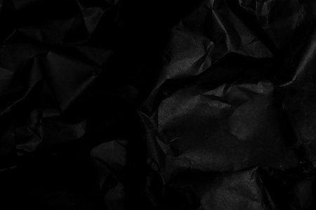black creased crumpled paper background grunge texture backdrop
