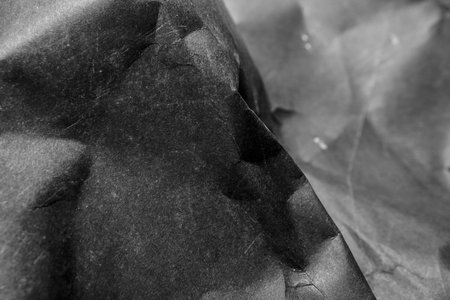 black creased crumpled paper background grunge texture backdrop