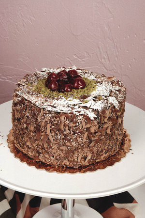 Board with delicious cake on table
