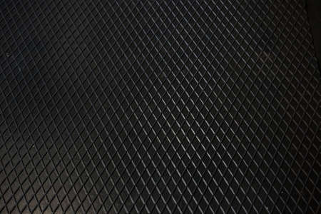 Black metal texture steel background. Perforated sheet metal.の写真素材