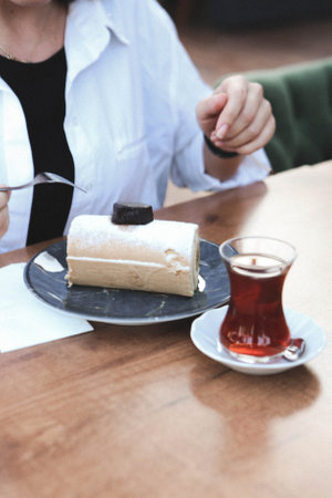 Board with delicious cake on tableの写真素材