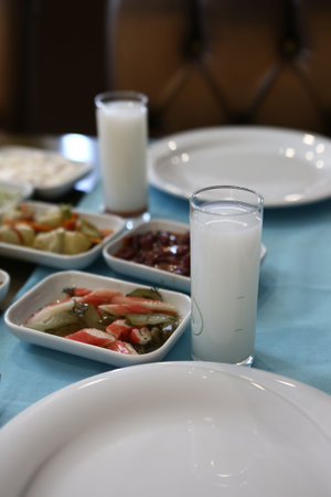 Turkish and Greek Traditional Dinning Table with Special Alcohol Drink Raki. Ouzo and Turkish Raki...